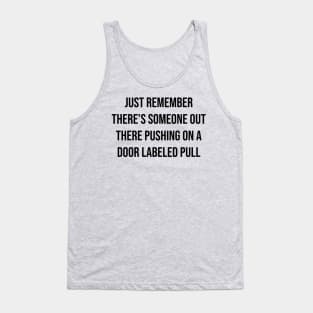 There's someone out there pushing on a door labeled pull Tank Top